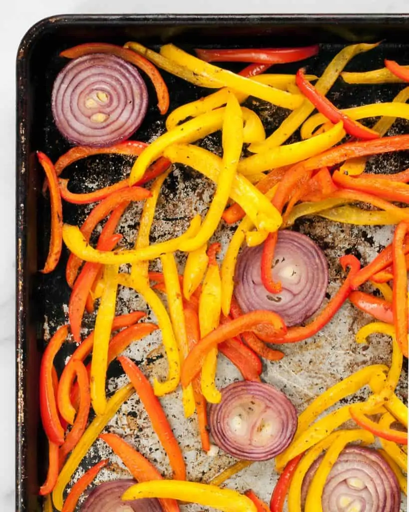 Roasted peppers and onions on sheet pan