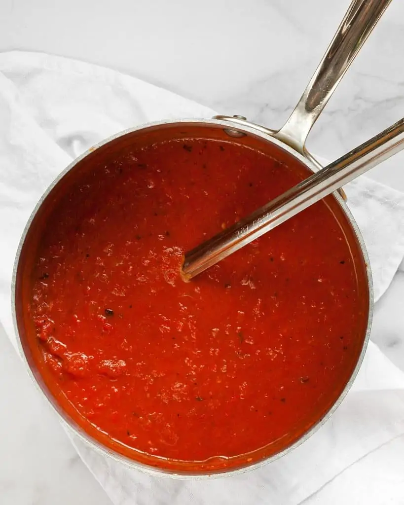 A large pot of red pepper tomato soup
