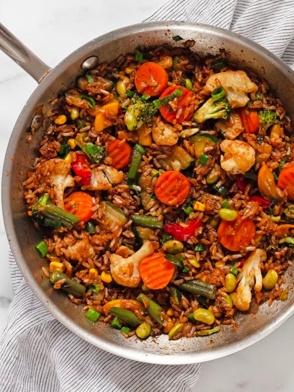 Vegetable stir fry with frozen veggies in a skillet.