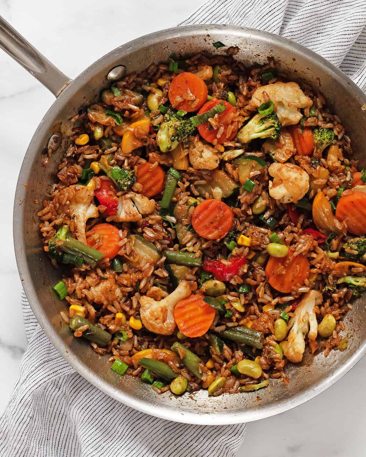 Vegetable stir fry with frozen veggies in a skillet.