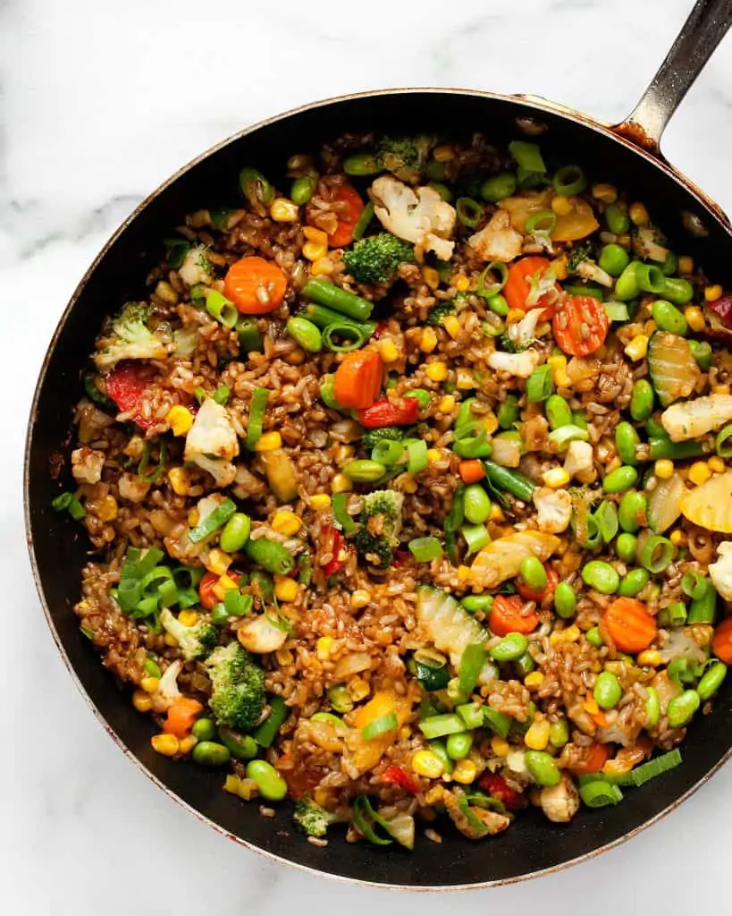 Frozen vegetable stir-fry with rice in a skillet
