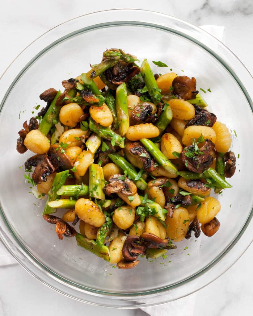 Stir the lemon juice and roasted garlic into the gnocchi, asparagus and mushrooms in a bowl