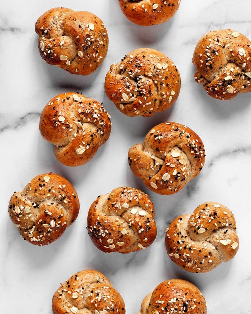 Oatmeal bread knots topped with everything seasoning