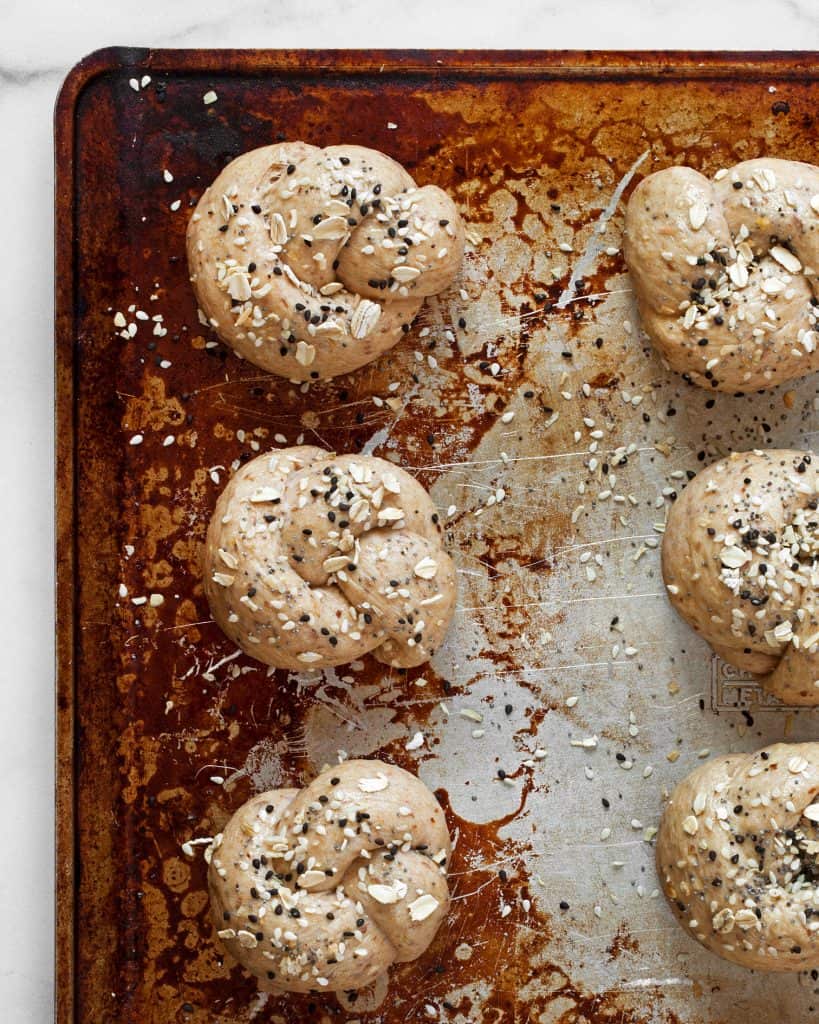 Dough shaped in knots on a sheet pan