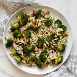 Orzo with roasted broccoli, almonds, lemon and garlic on a plate.