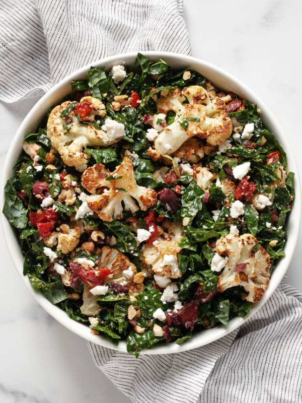 Kale salad with roasted cauliflower, tomatoes, olives and feta.