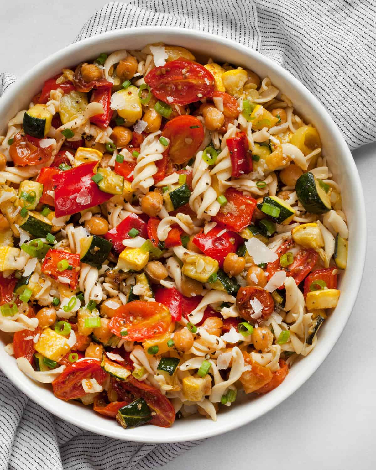 Roasted vegetable chickpea pasta salad in a bowl.