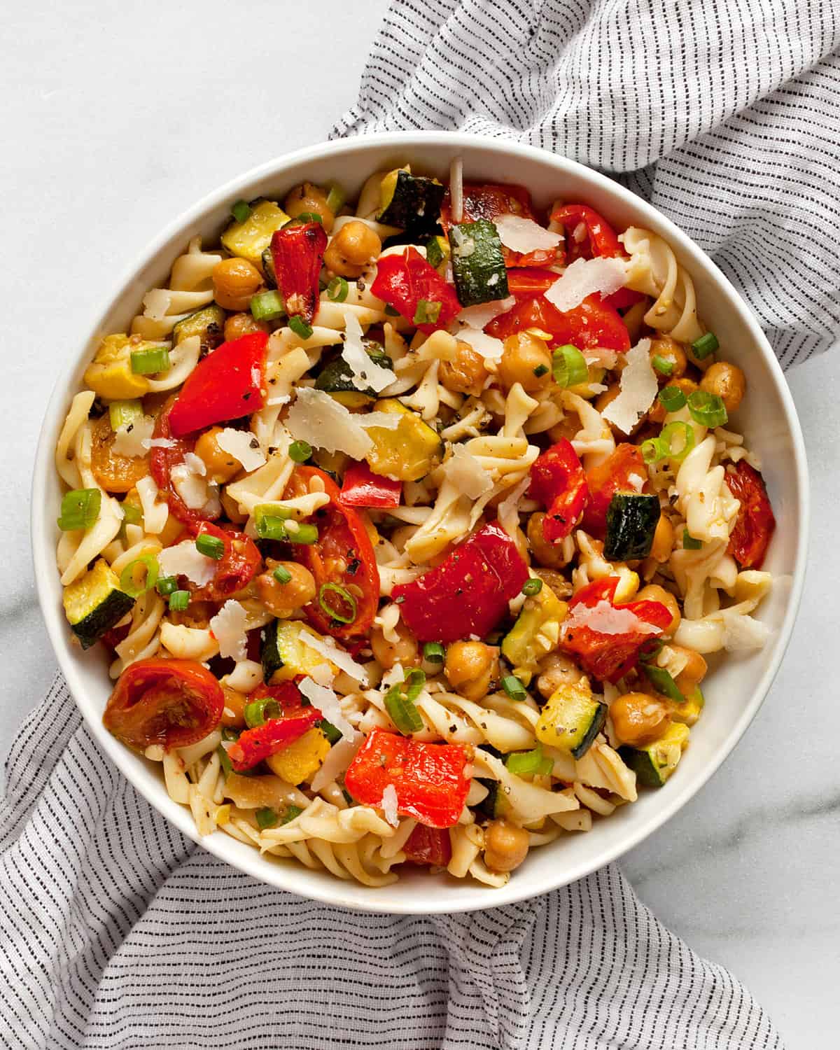 Roasted vegetable chickpea pasta salad in a bowl.