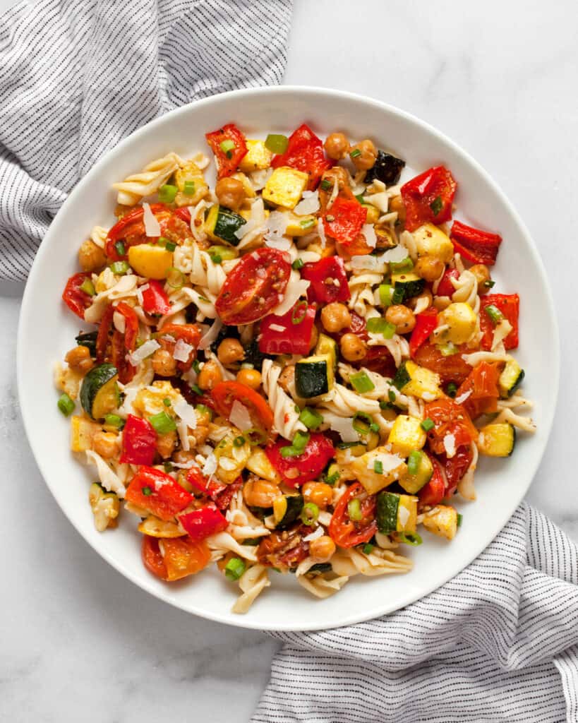 Roasted vegetable chickpea pasta salad on a plate.