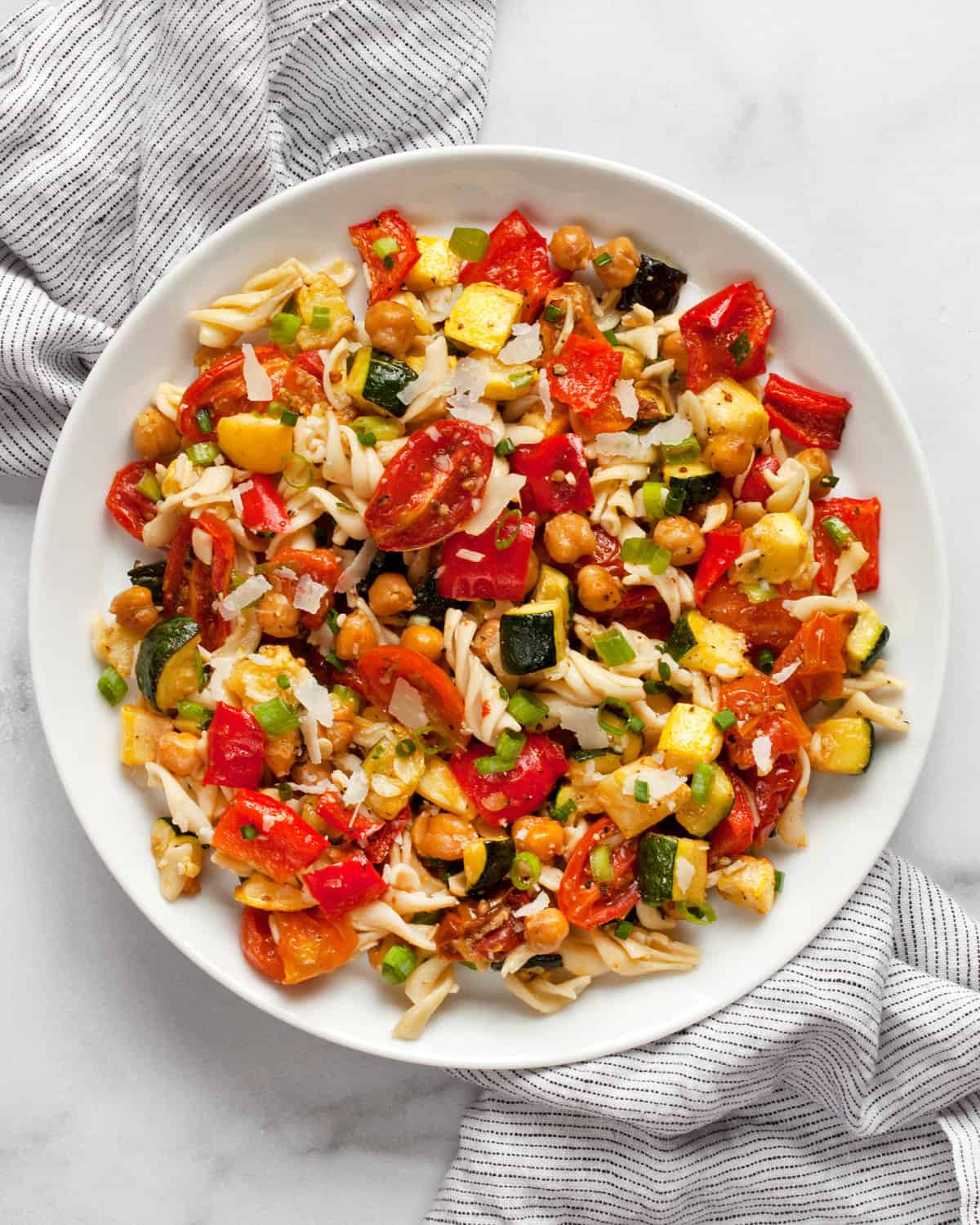 Roasted vegetable chickpea pasta salad on a plate.