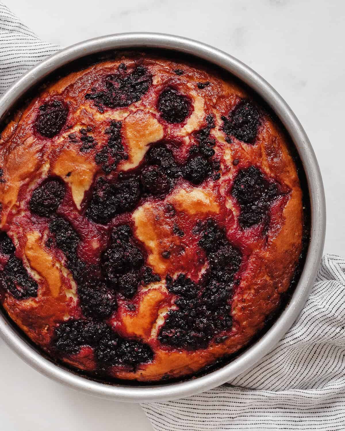 Blackberry lemon cake in a pan.