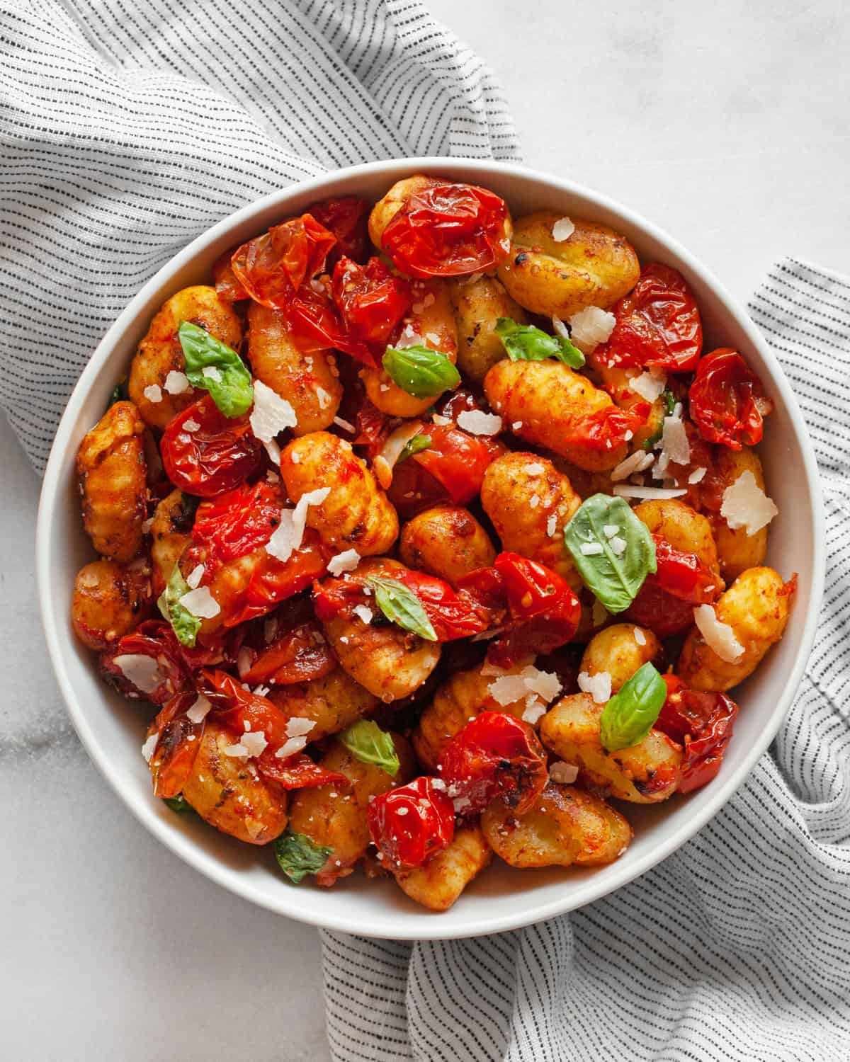 Cherry tomato sheet pan gnocchi in a bowl.