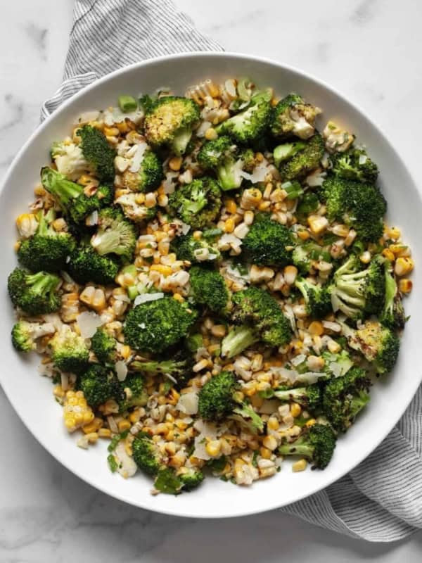 Grilled corn broccoli salad in a bowl.
