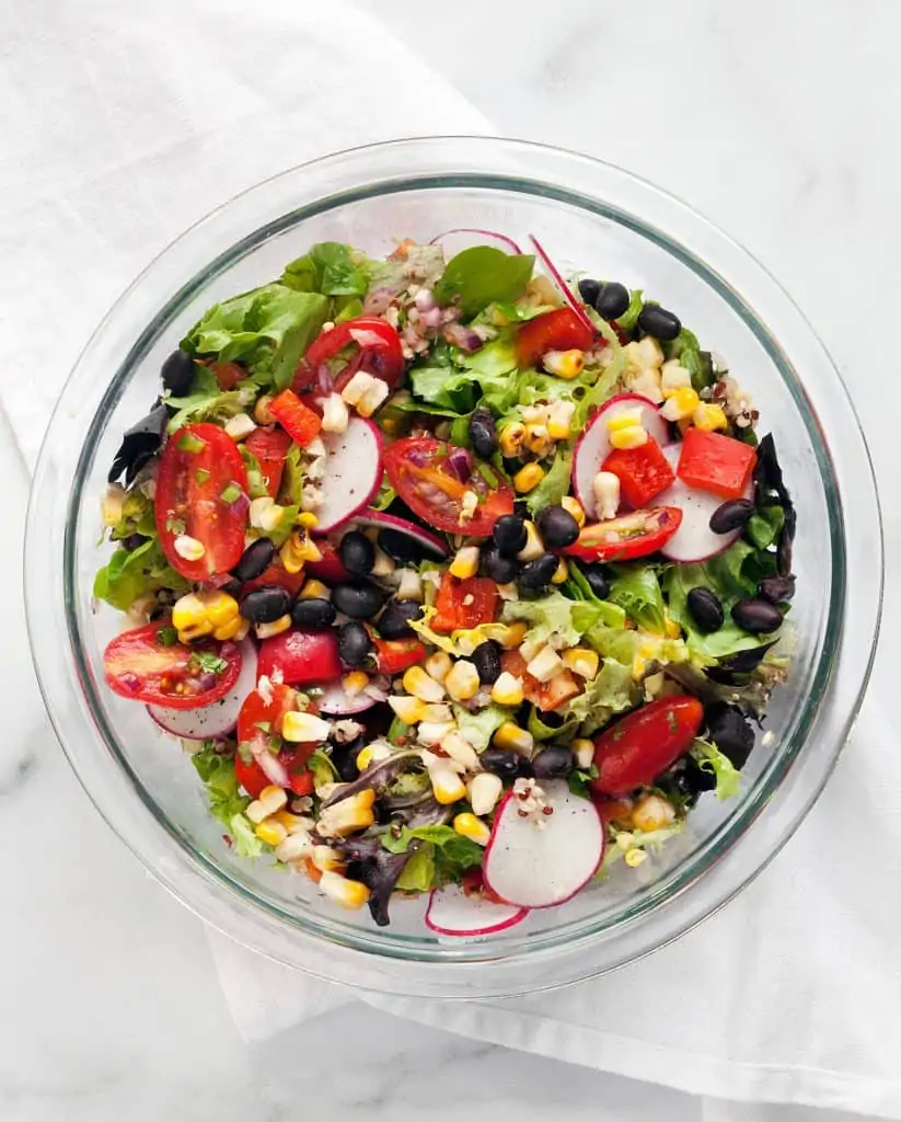 Combine the salad ingredients in a bowl