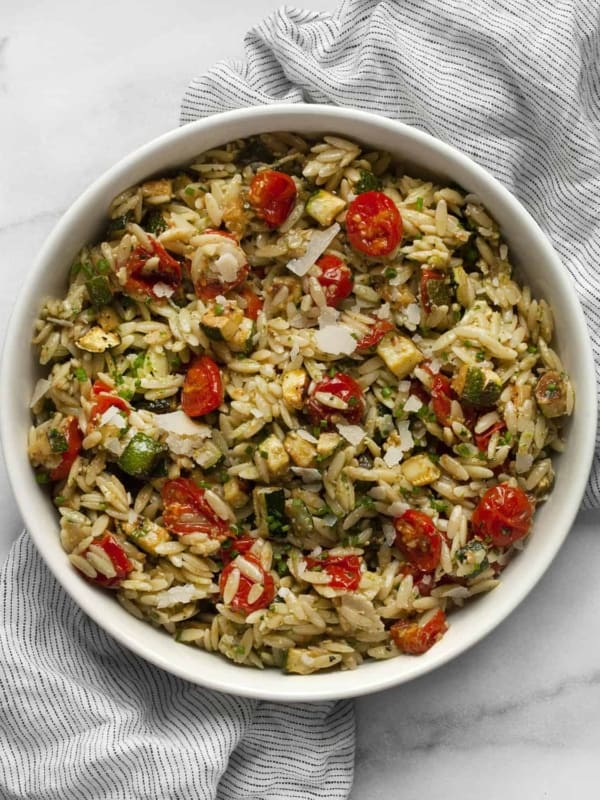 Roasted zucchini tomato orzo in a bowl.