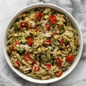 Roasted zucchini tomato orzo in a bowl