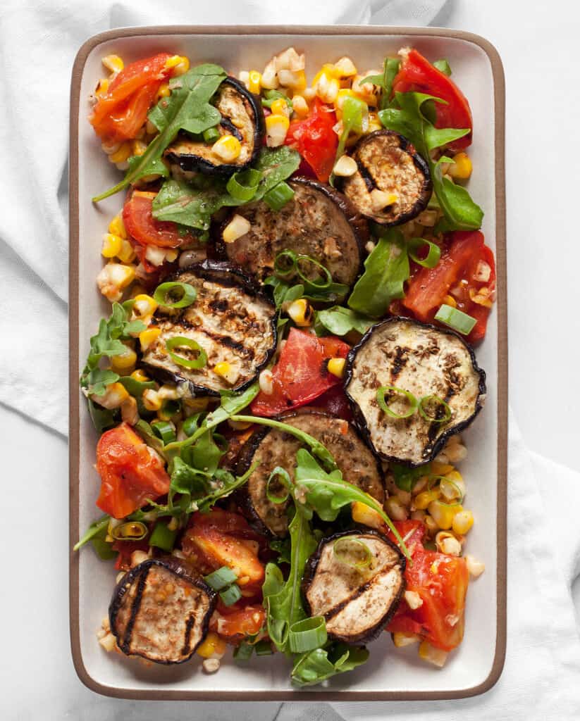 Grilled eggplant, tomatoes and corn