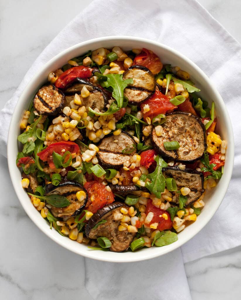 Grilled eggplant with corn and tomatoes