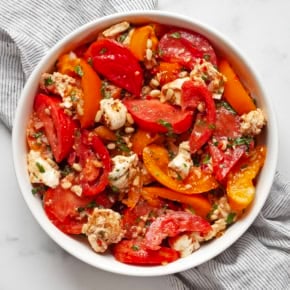 Heirloom tomato salad in a large bowl.