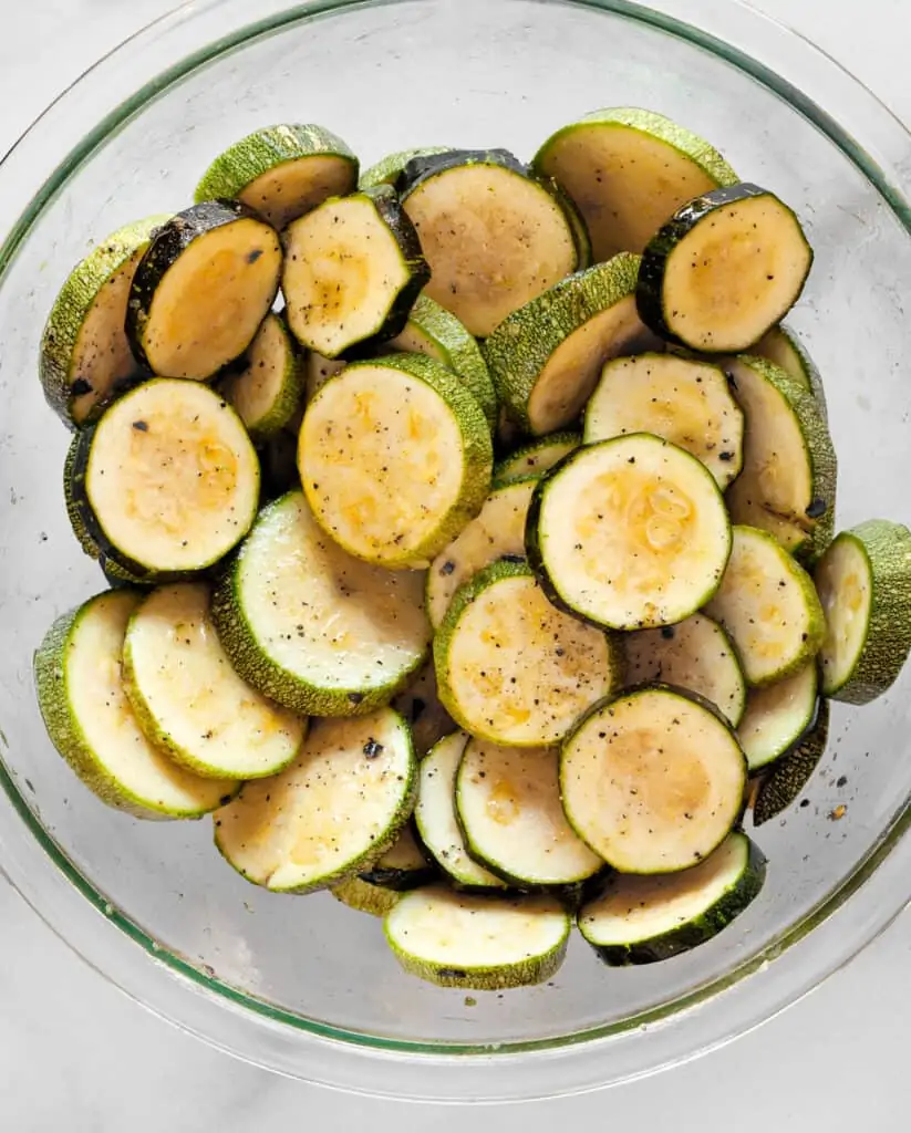 Toss the zucchini with spices and olive oil