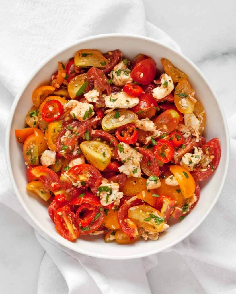 Marinated tomato salad with mozzarella and chilies