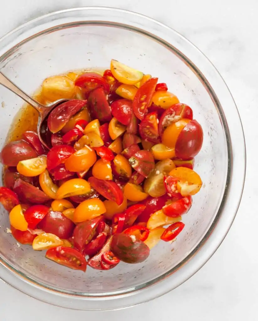 Stir together the tomatoes and vinaigrette