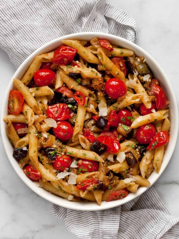 Cherry tomato eggplant pasta in a bowl.