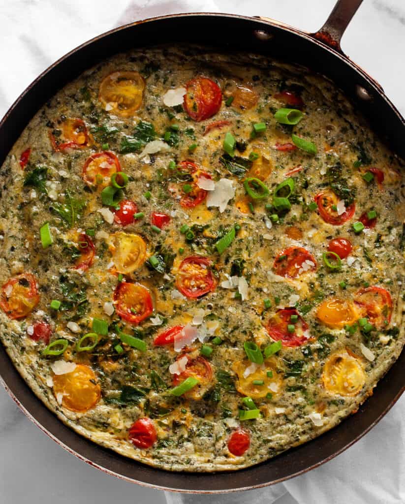 Vegetarian frittata with tomatoes and kale