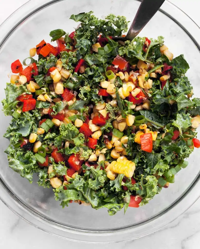 Toss together the kale, corn and peppers