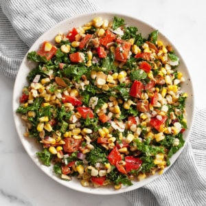 Grilled corn pepper kale salad in a bowl.