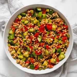Harissa roasted tomato couscous in a bowl.