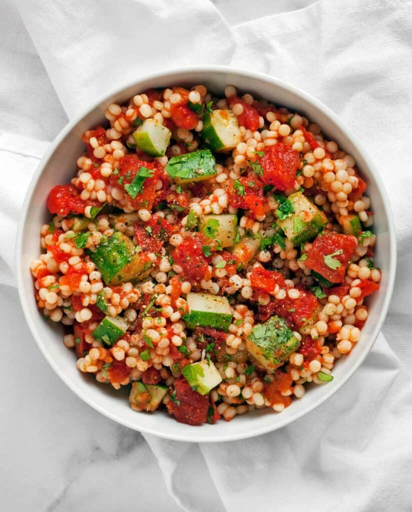 Pearl Couscous with Harissa Roasted Tomatoes and Cucumbers