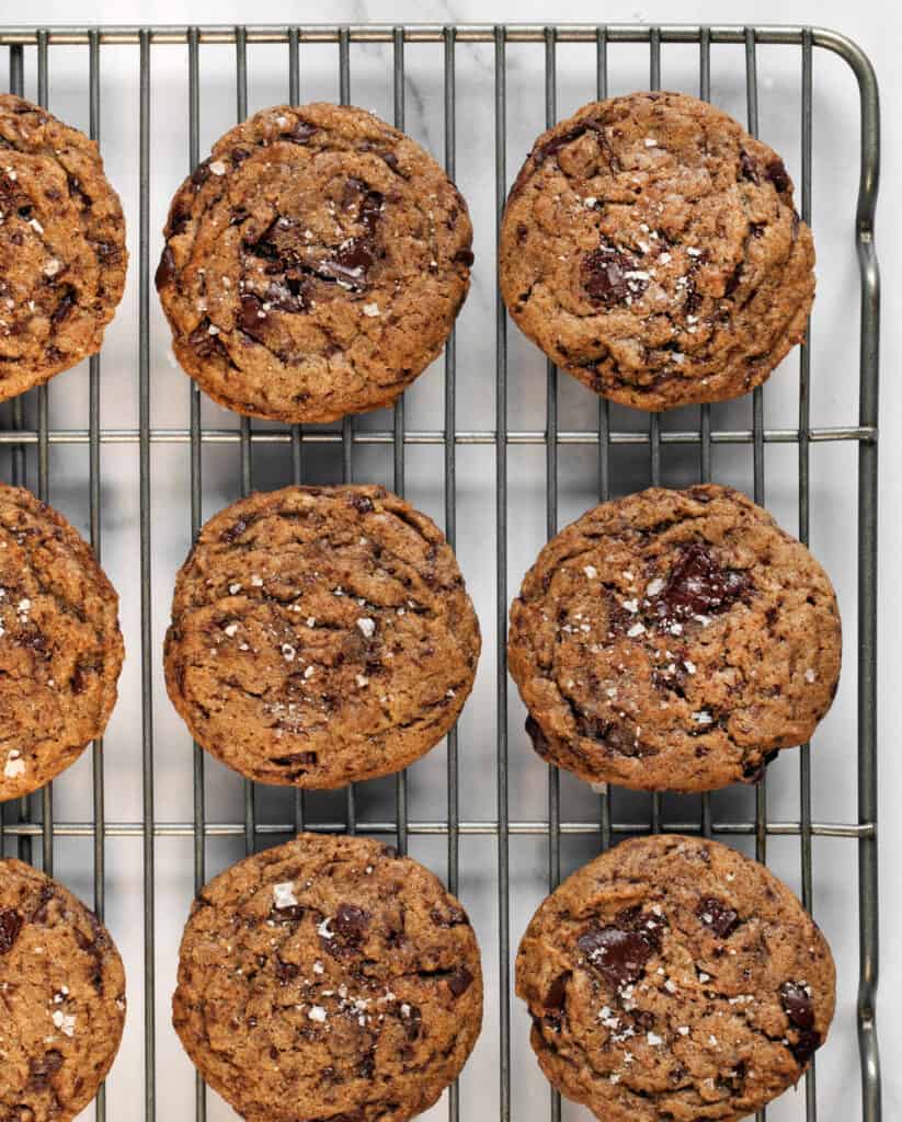 Vegan cinnamon chocolate chip Cookies cooling on a rack