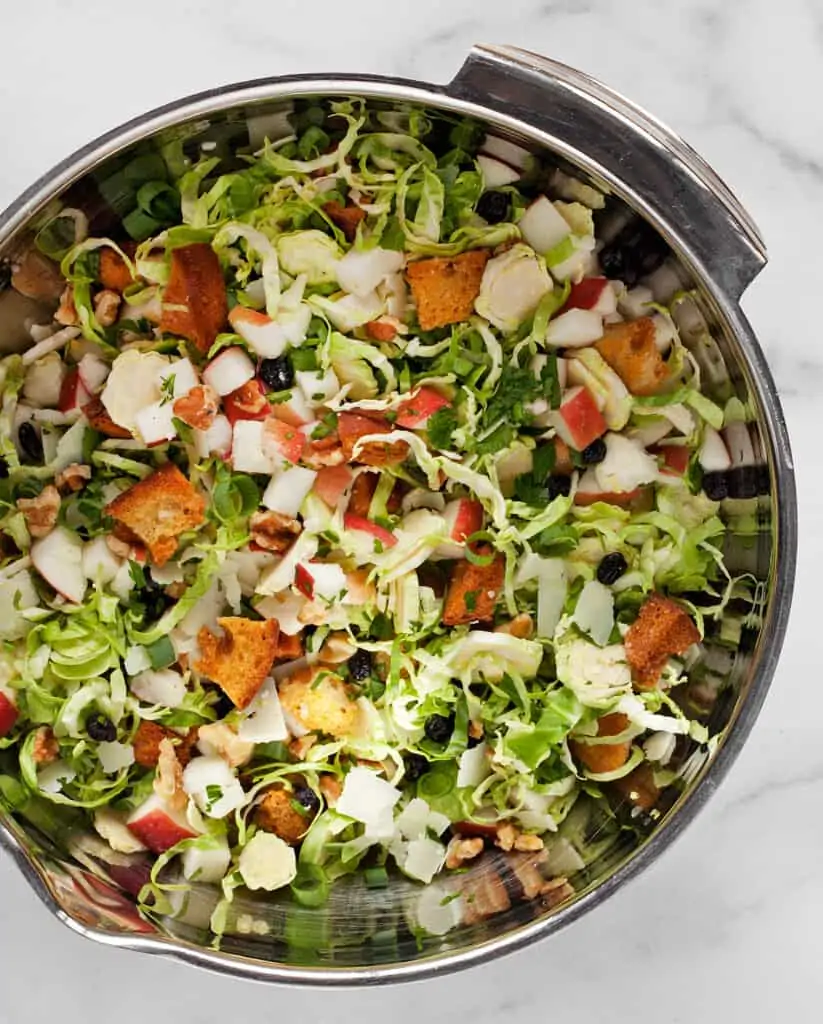 Stir together the brussels sprouts, apples and herbs in a bowl
