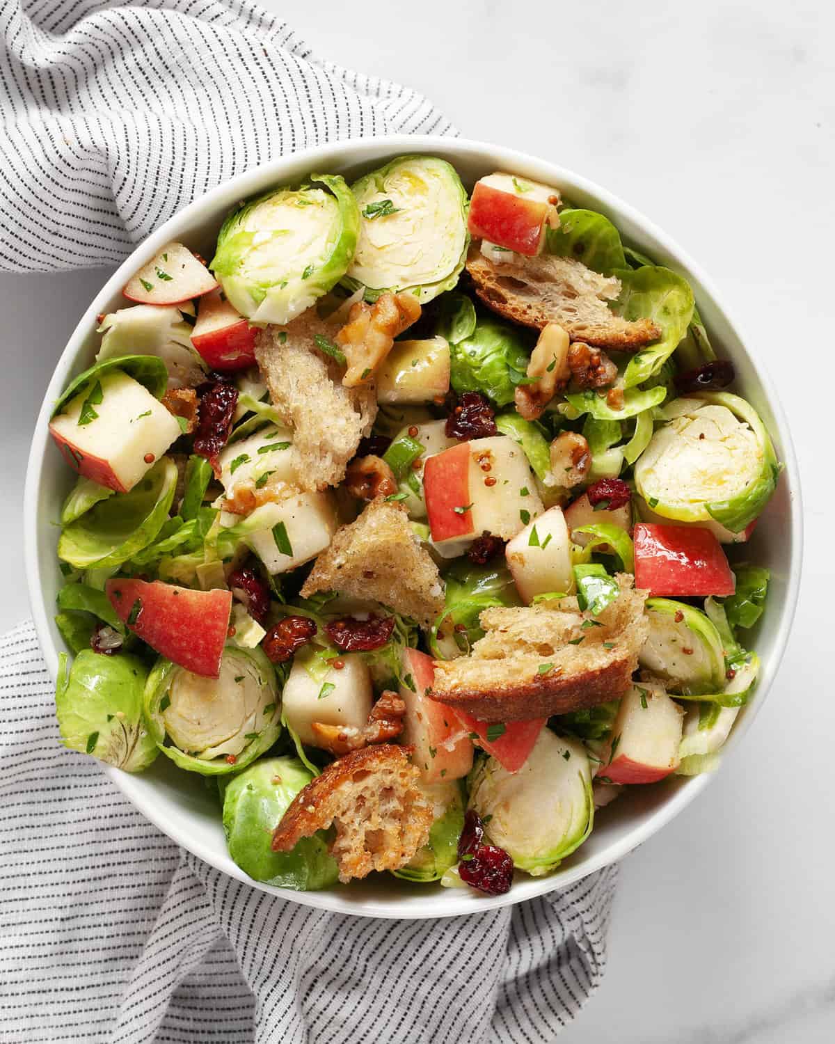 Brussels sprout apple salad in a bowl.