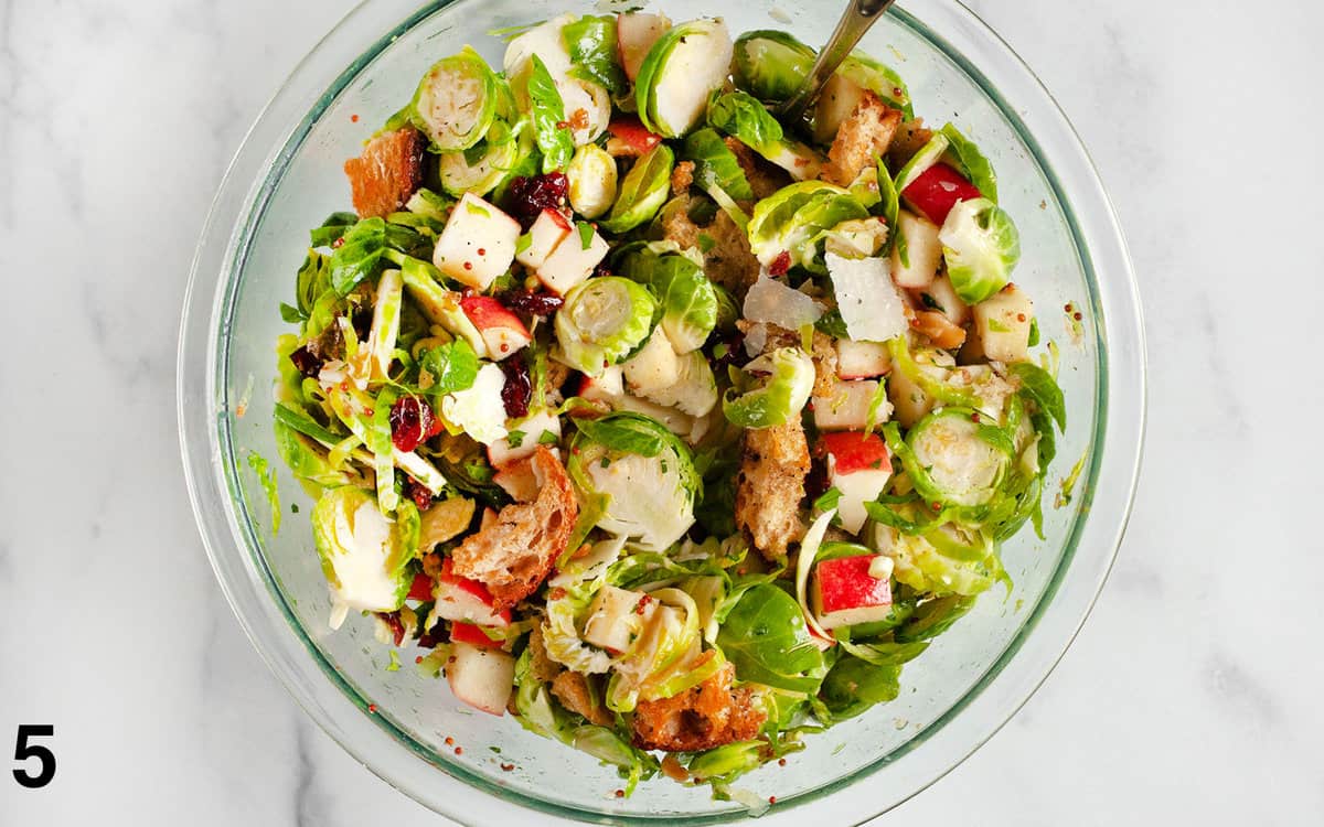 Croutons stirred into salad.