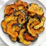 Parmesan roasted acorn squash on a plate.