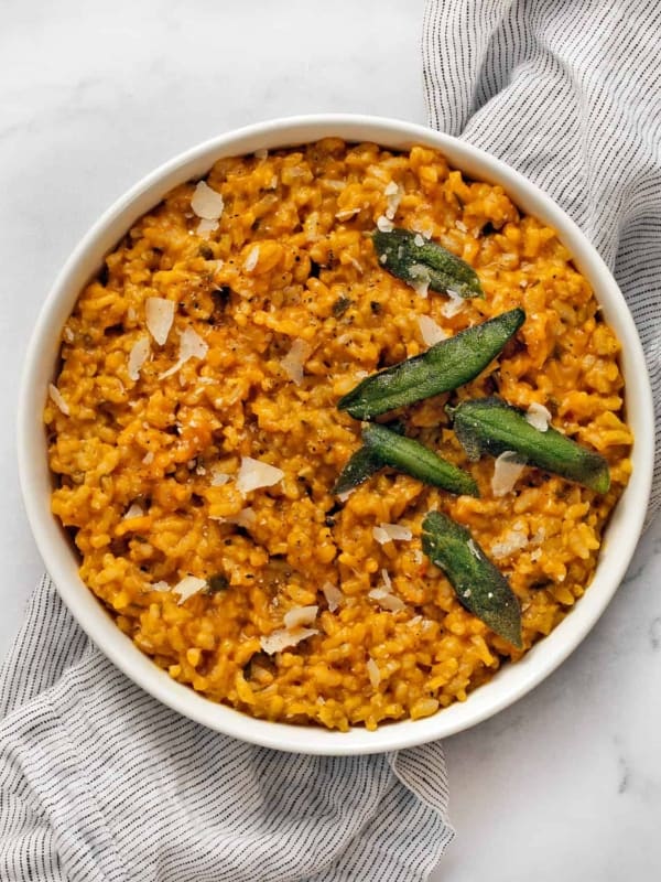 Baked pumpkin risotto in a large white bowl.