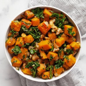 Sautéed butternut squash with kale in a bowl.