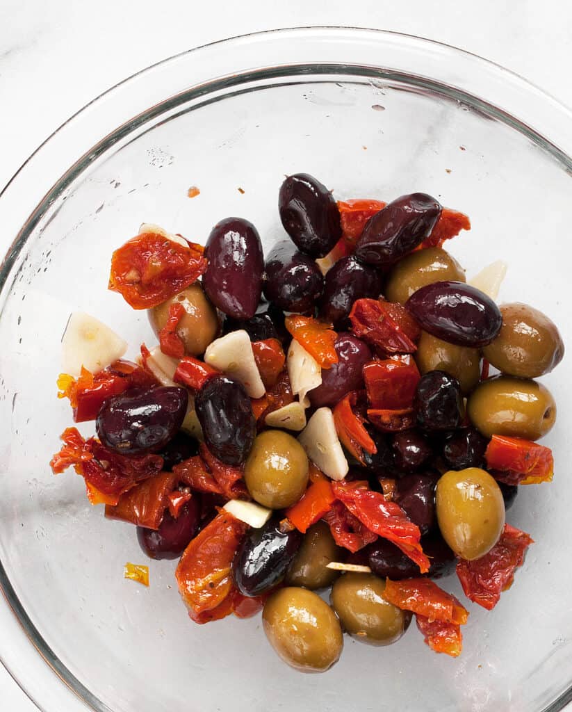 Olives, tomatoes and garlic in a bowl