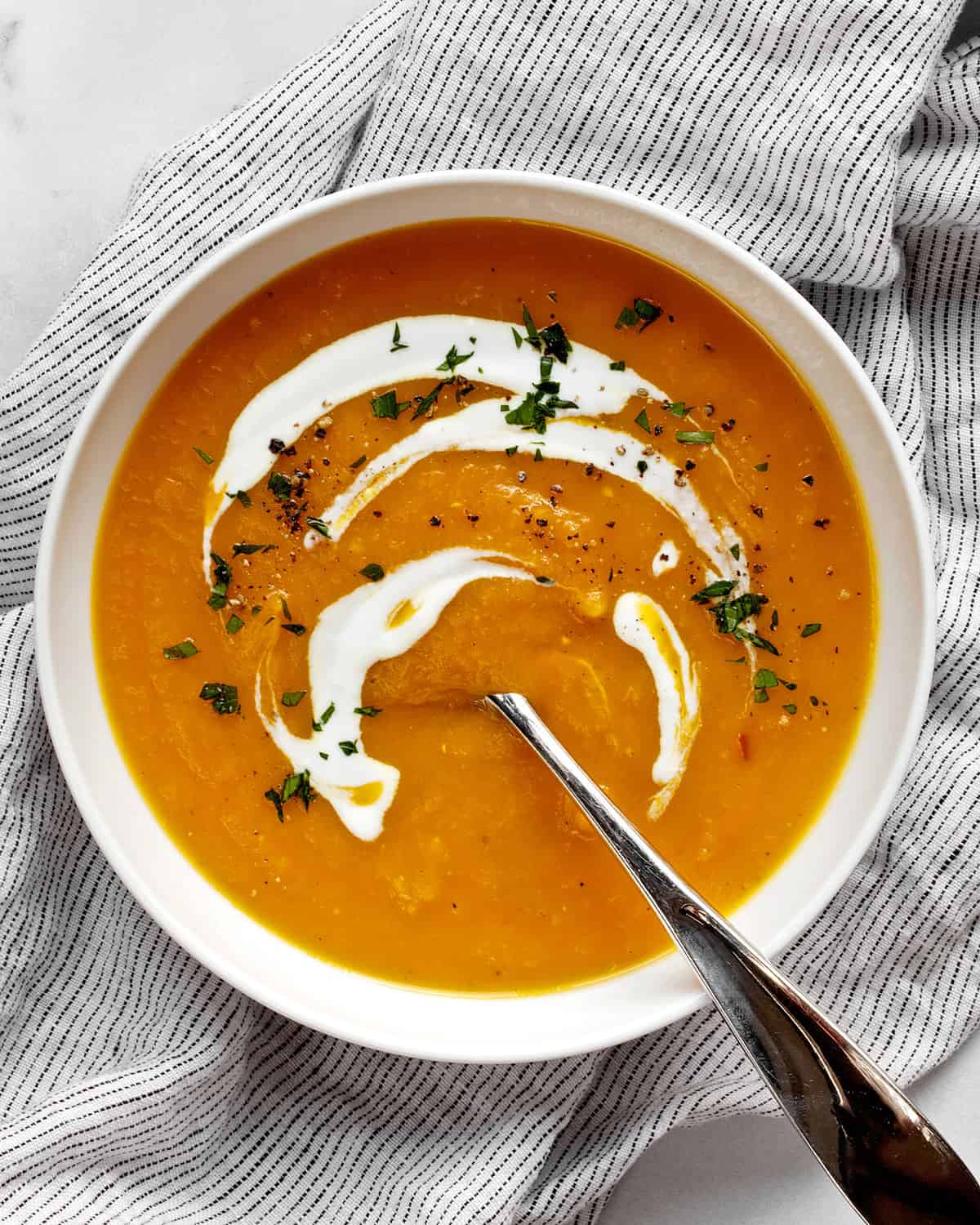 Butternut squash apple soup in a bowl.