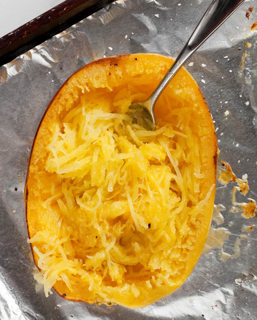 Combing roasted spaghetti squash flesh with a fork