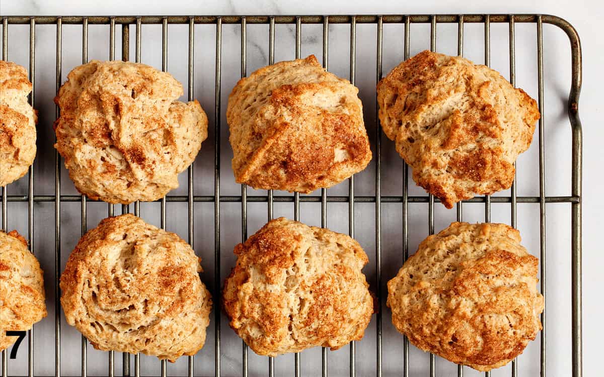 Baked scones on a wire rack.