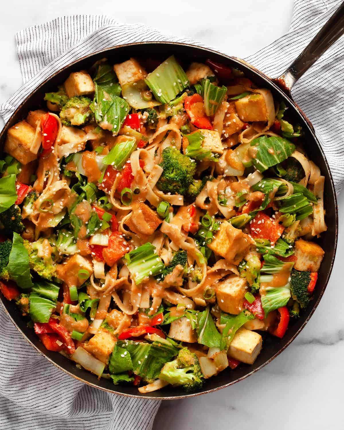 Tofu vegetable stir-fry in a skillet.