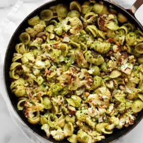 Roasted Cauliflower Spinach Pesto Pasta in a skillet