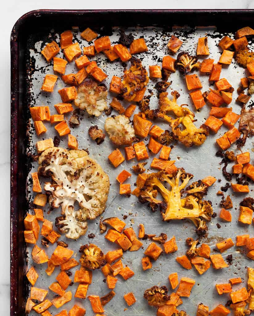 Roasted sweet potatoes and cauliflower on sheet pan