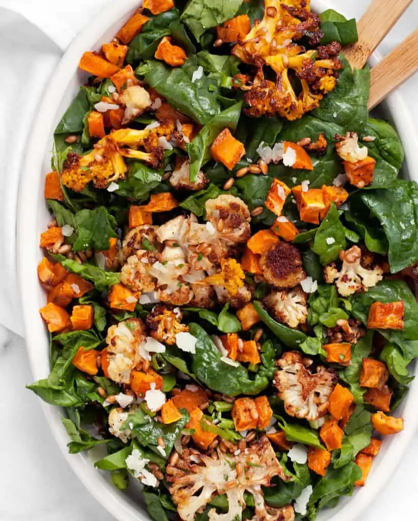Spinach salad with roasted cauliflower and sweet potatoes