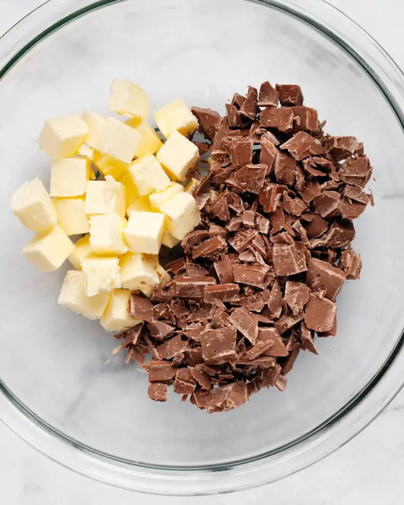 Cubed butter and chopped milk chocolate in a bowl