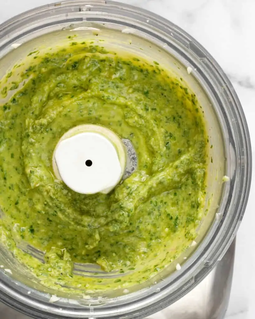 Pureed avocado pesto in the food processor