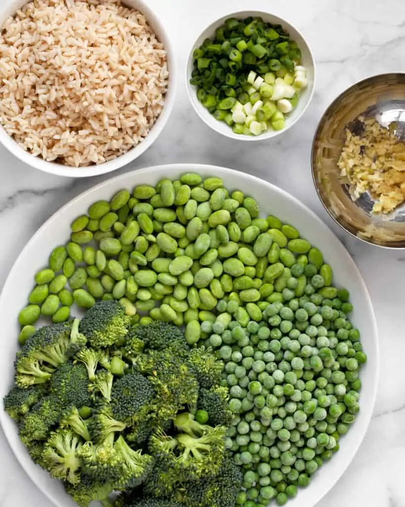 Ingredients including broccoli and frozen peas and edamame